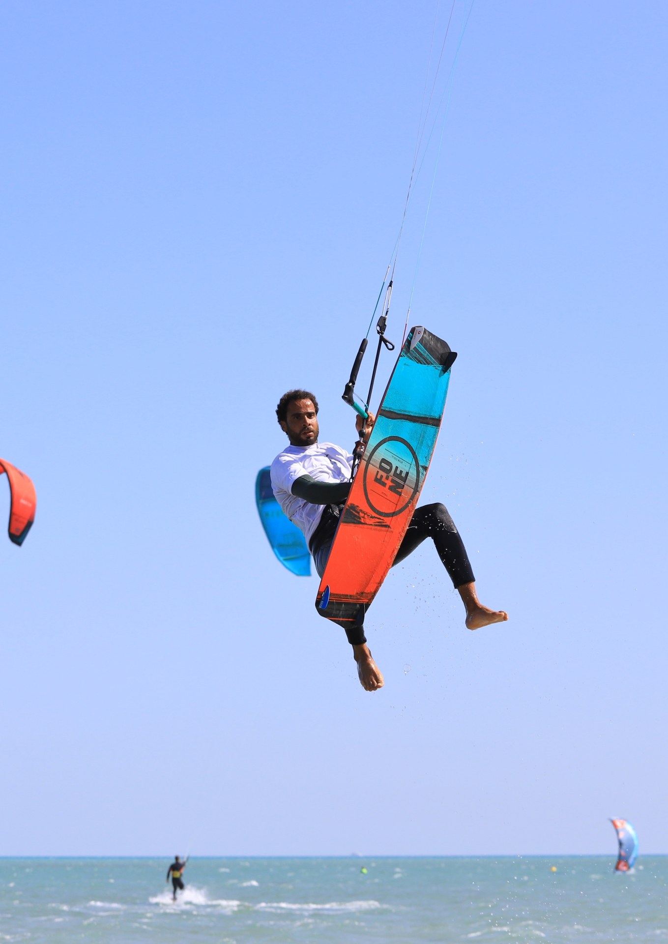 Advanced kitesurfer big-air jump