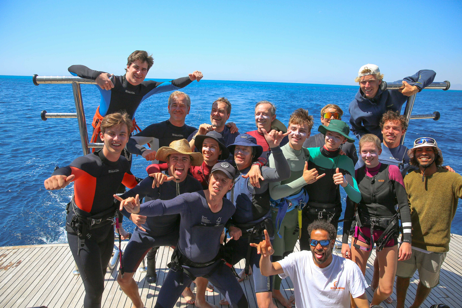 Red Sea Kitesurfing crew celebrating on the boat deck