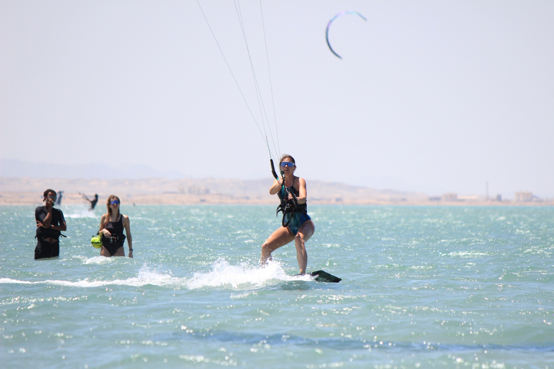 Female student riding upwind during lesson