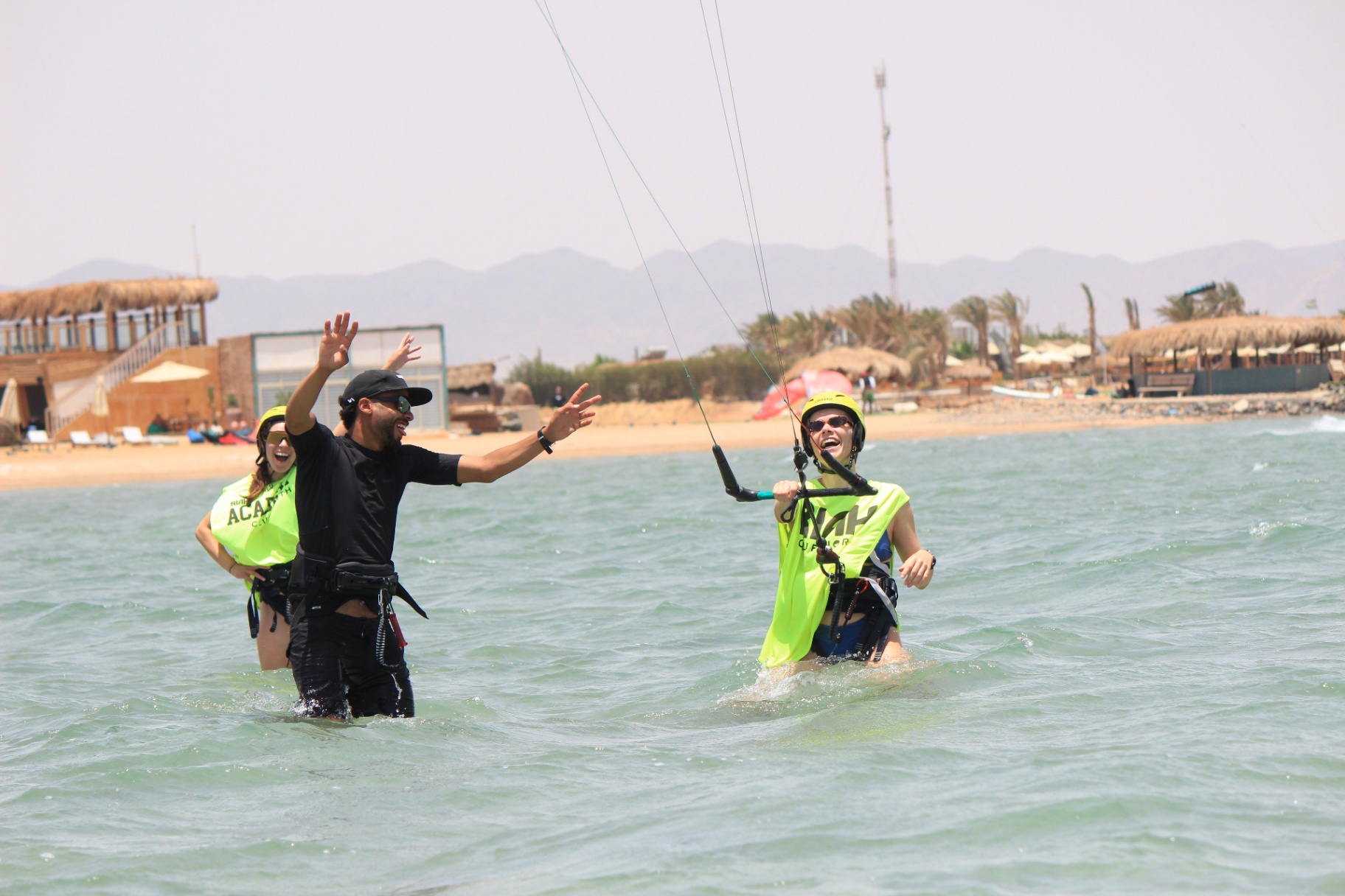 Instructor coaching students during a kite lesson