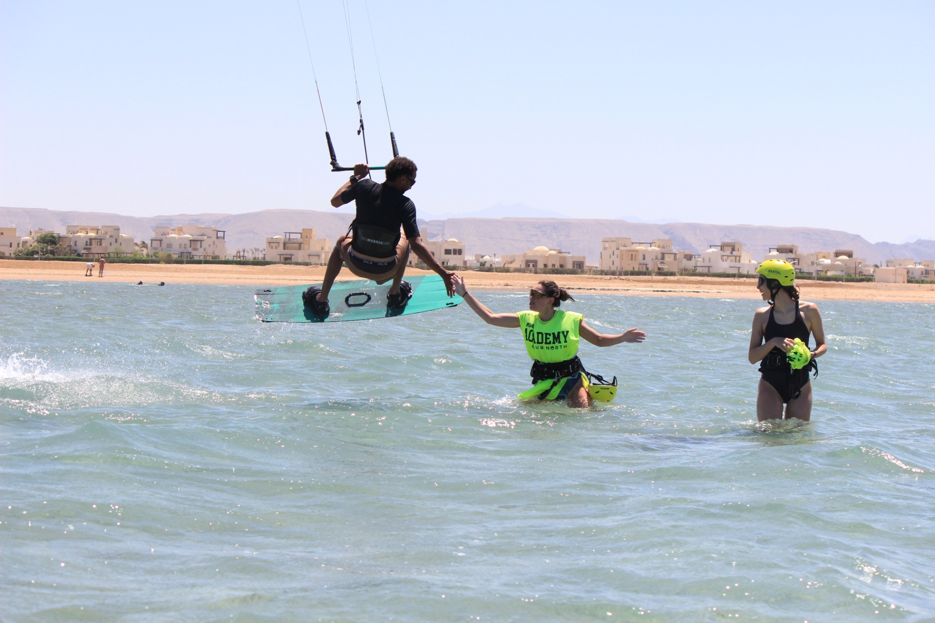 Instructor showing kite jump to students