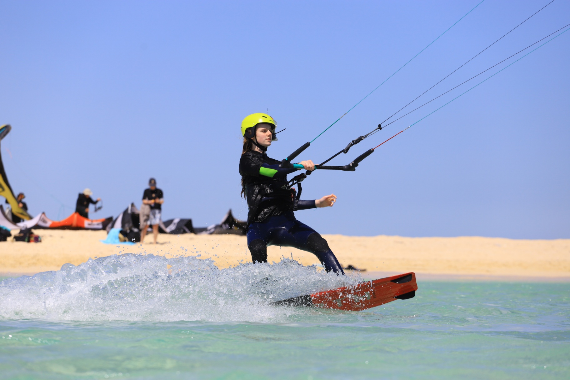 Student riding in shallow turquoise water