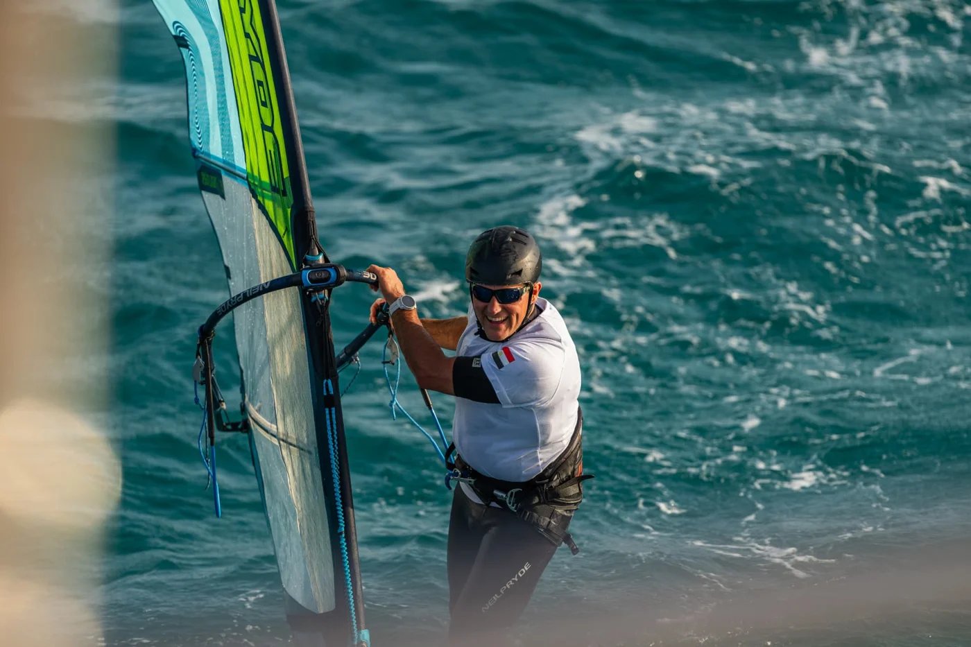 Smiling windsurfer sailing on the Red Sea