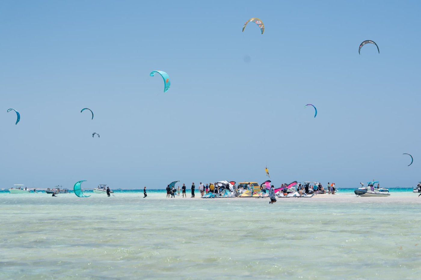 Wide sandy kite beach with many kites at Abu Mungar near Hurghada